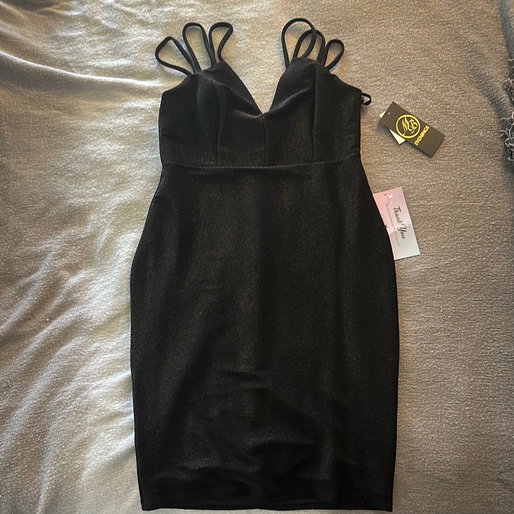 Elegant Black Dress with Unique Strap Design
